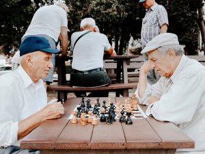 Elderly men playing chess
