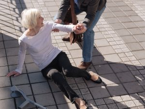 Elderly lady on the ground