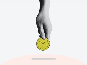 Hand holding clock