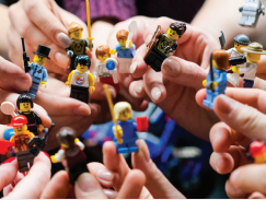Hands holding lego