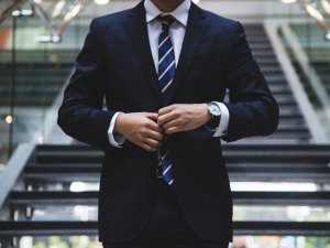 Man in suit CR Hunters Race on Unsplash