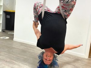 Hayley Scott upside down in a sheet