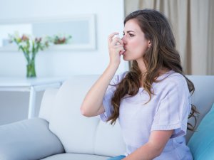 asthma inhaler in use Wavebreakmedia FreeImages