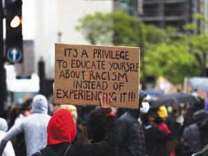 Racism Protest Sign CR James-eades on Unsplash