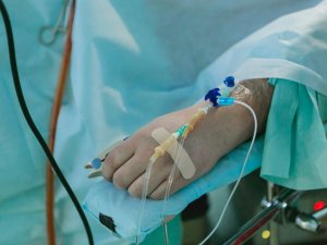 Patient in hospital bed with IV