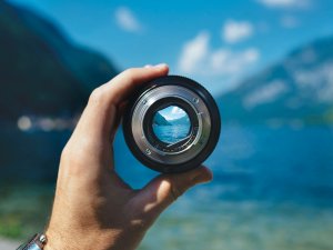 Camera lens Held up CR Paul Skorupskas on Unsplash