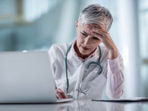 Doctor, stressed, computer, patient portal [CR BraunS on iStock]