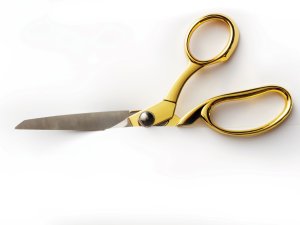 Golden Scissors Cutting CR Floortje on iStock