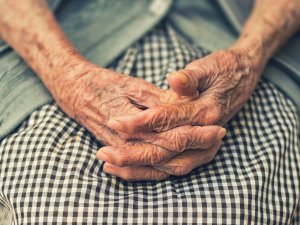 Elderly hands CR Cristian Newman on Unsplash