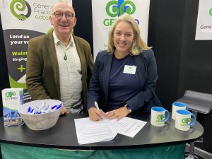 Buzz Burrell and Stephanie Taylor signing MOU