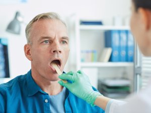 Man having oral examination CR SeventyFour on iStock