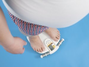 Overweight man on scales 