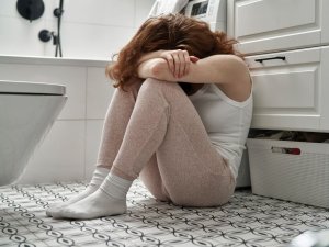 Woman on bathroom floor CR Gpointstudio on iStock