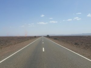 Open road, desert, dust tornados