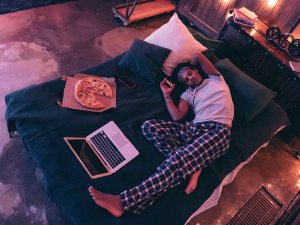 Eating on bed CR Yacobchuk on iStock