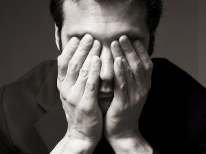 Man covering eyes CR Andipantz on iStock