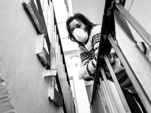 Woman balcony mask BW CR Coldsnowstorm on iStock
