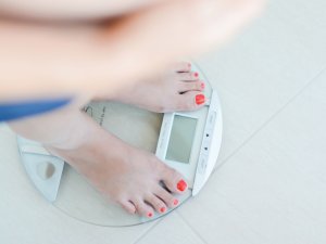 Pregnant woman on scales