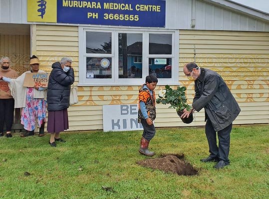 Murupara GP Bernard Conlon plants a rose in front of the medical centre