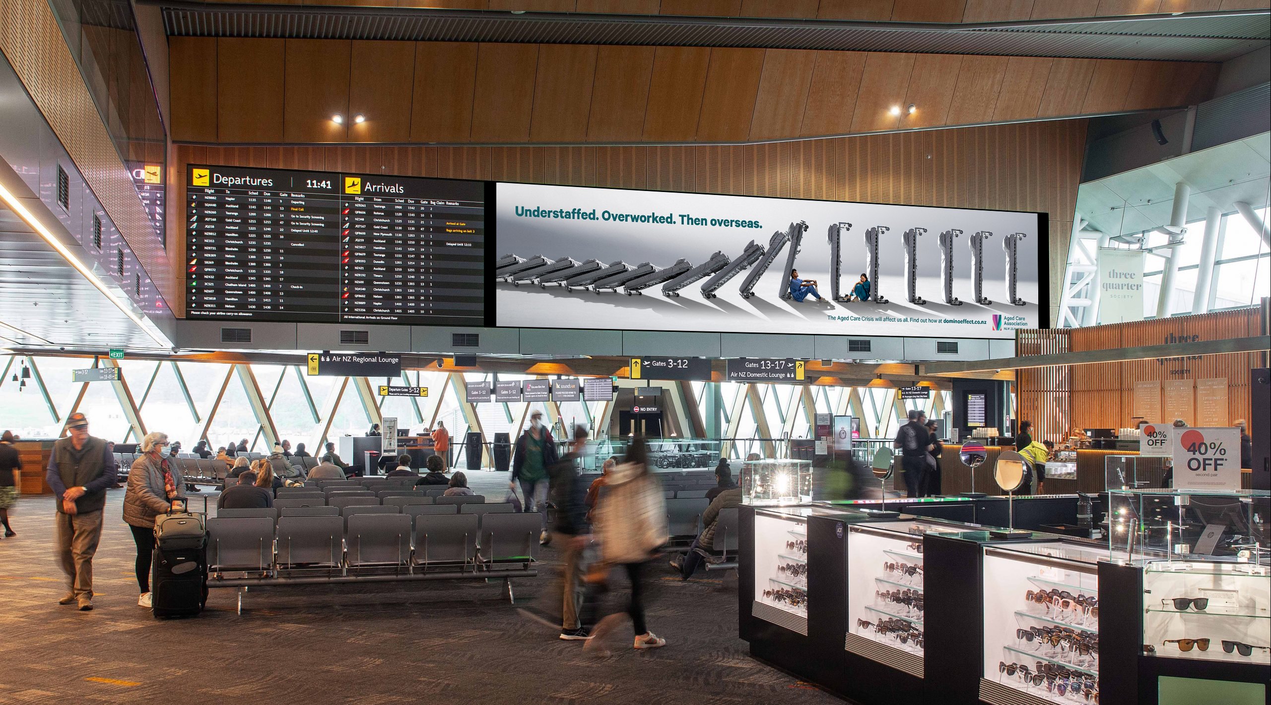 Domino Effect billboard inside an airport
