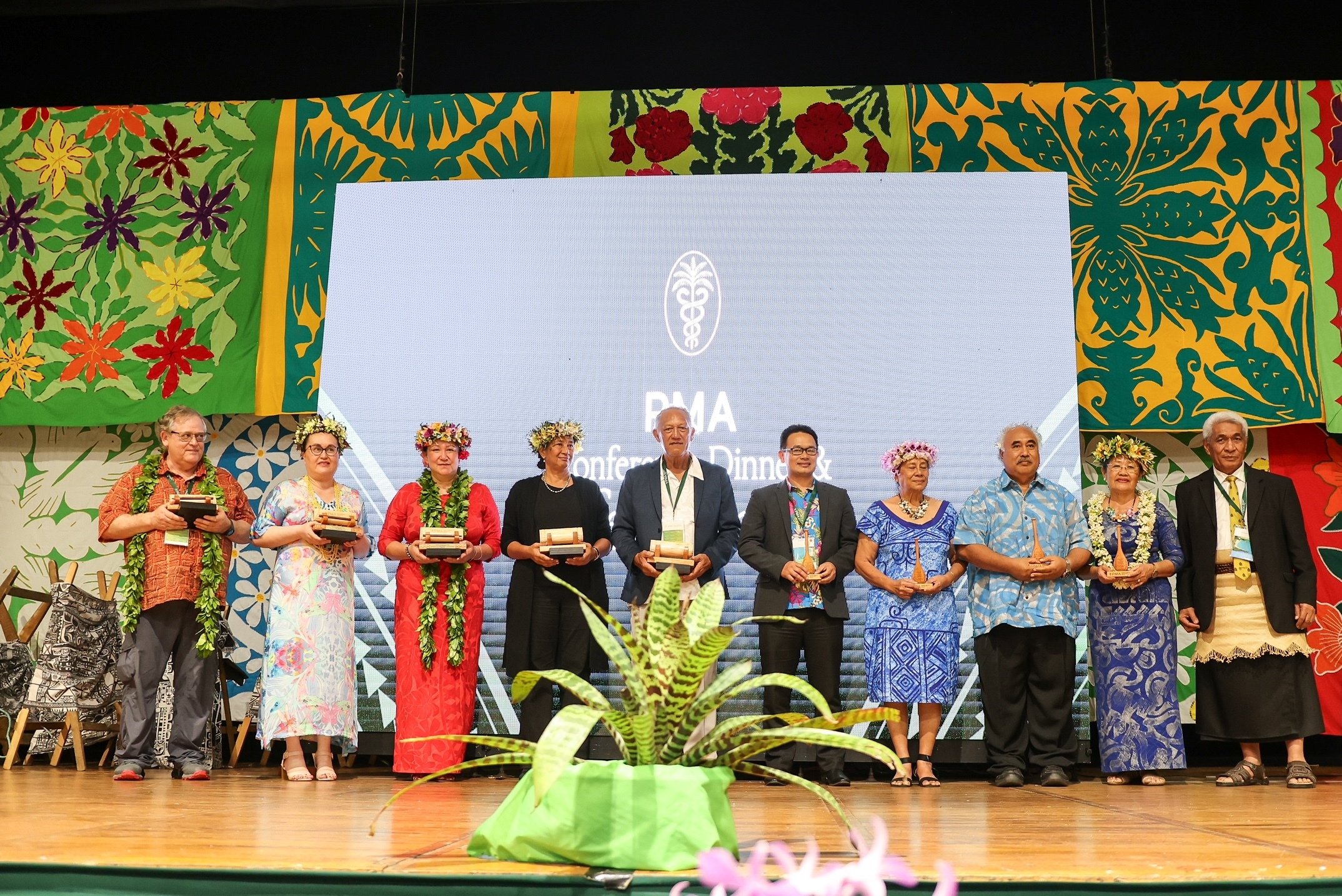 Cook Islands health leaders on stage with their awards at the Pasifika Medical Association conference