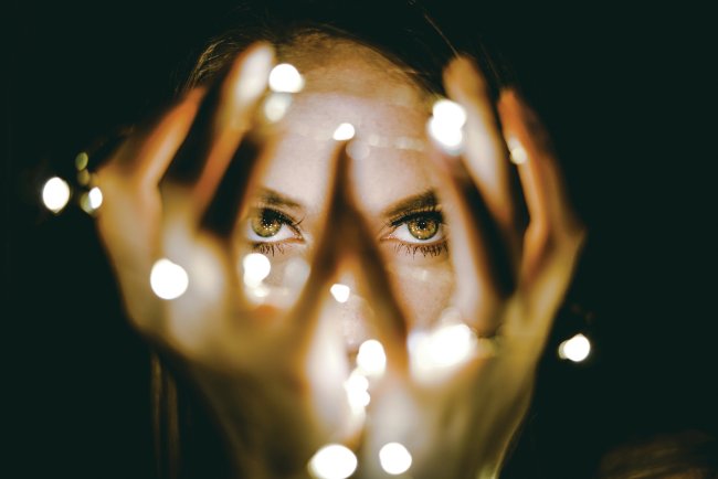 Woman's face with lights CR Rhett Wesley on Unsplash